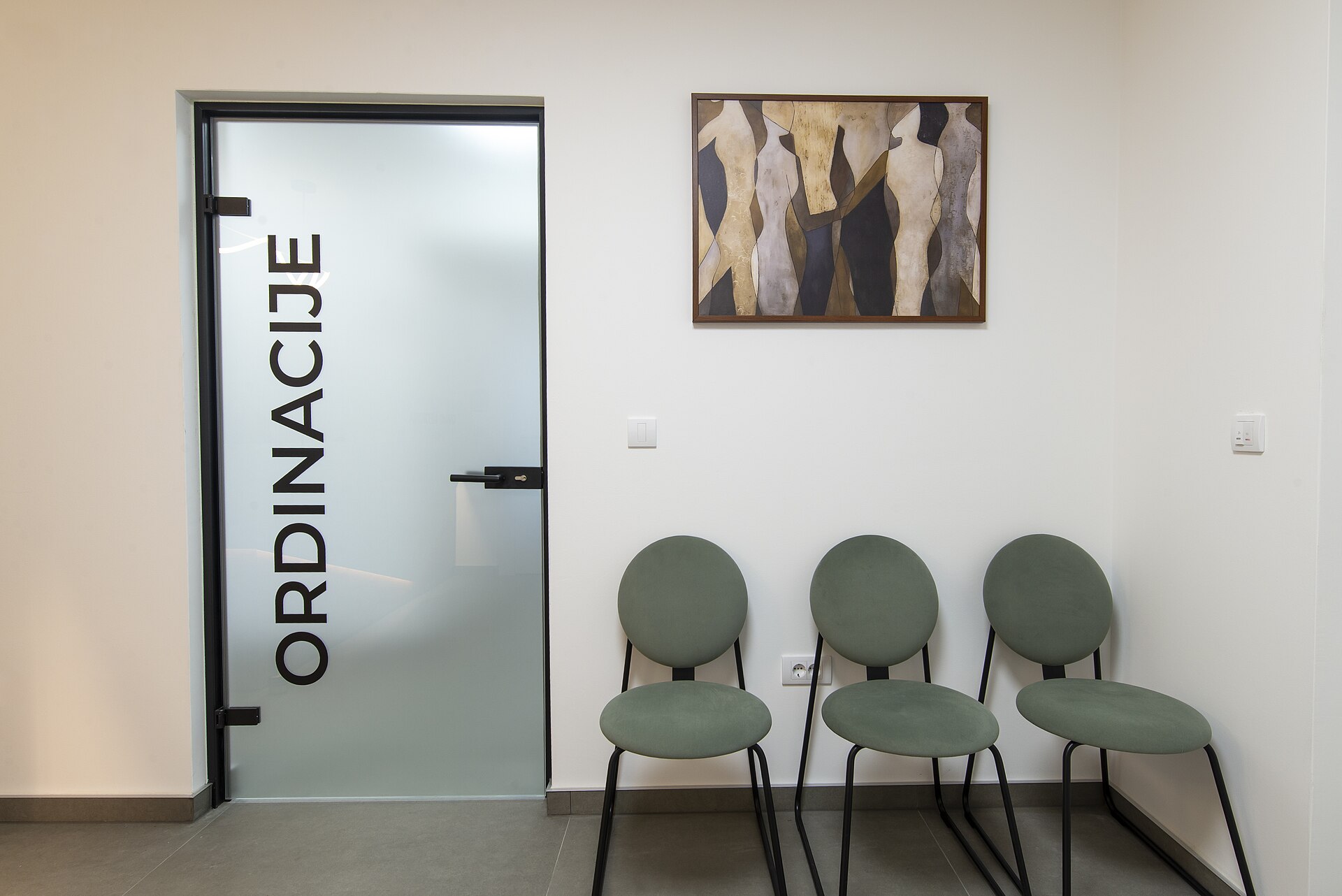 A waiting area with artwork on the wall